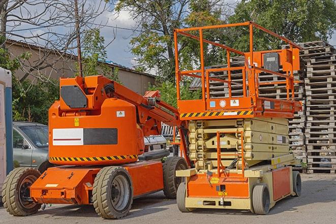 industrial forklift lifting heavy loads in warehouse in Akron